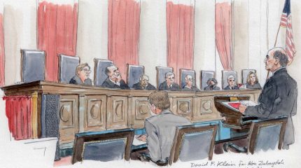 David Klien argues before eight justices on the bench.