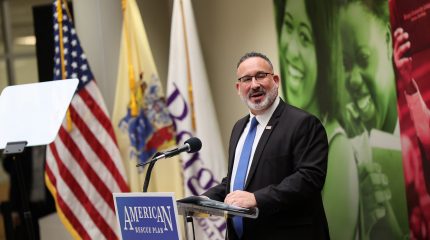 Man speaking at lectern