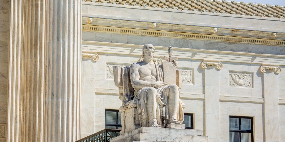 A statute on the steps on the Supreme Court