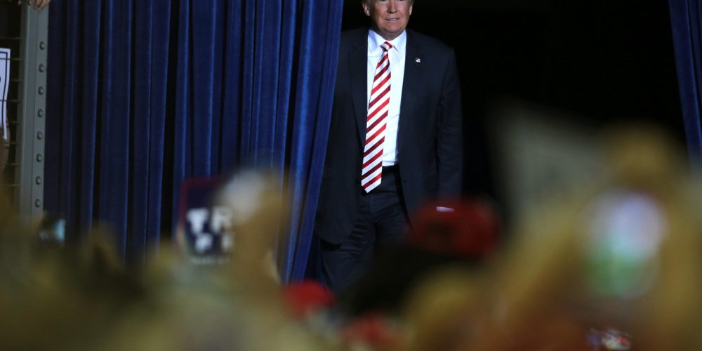 former President Donald Trump walking on stage