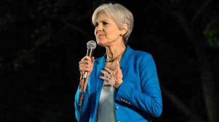 Jill Stein speaking into microphone