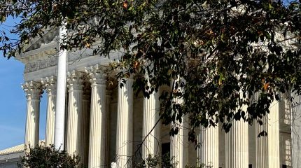 Supreme Court building with fall foliage