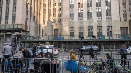 Reporters outside courthouse