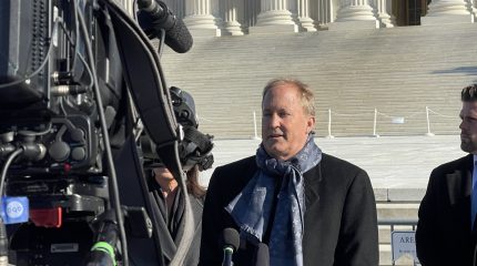 Man speaking before camera