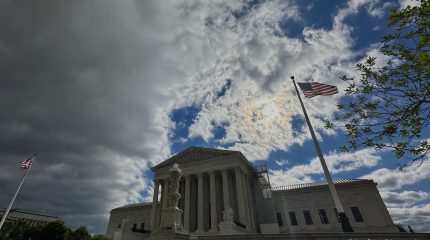 Supreme Court under clouded sky