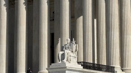 A statue on the Supreme Court steps.