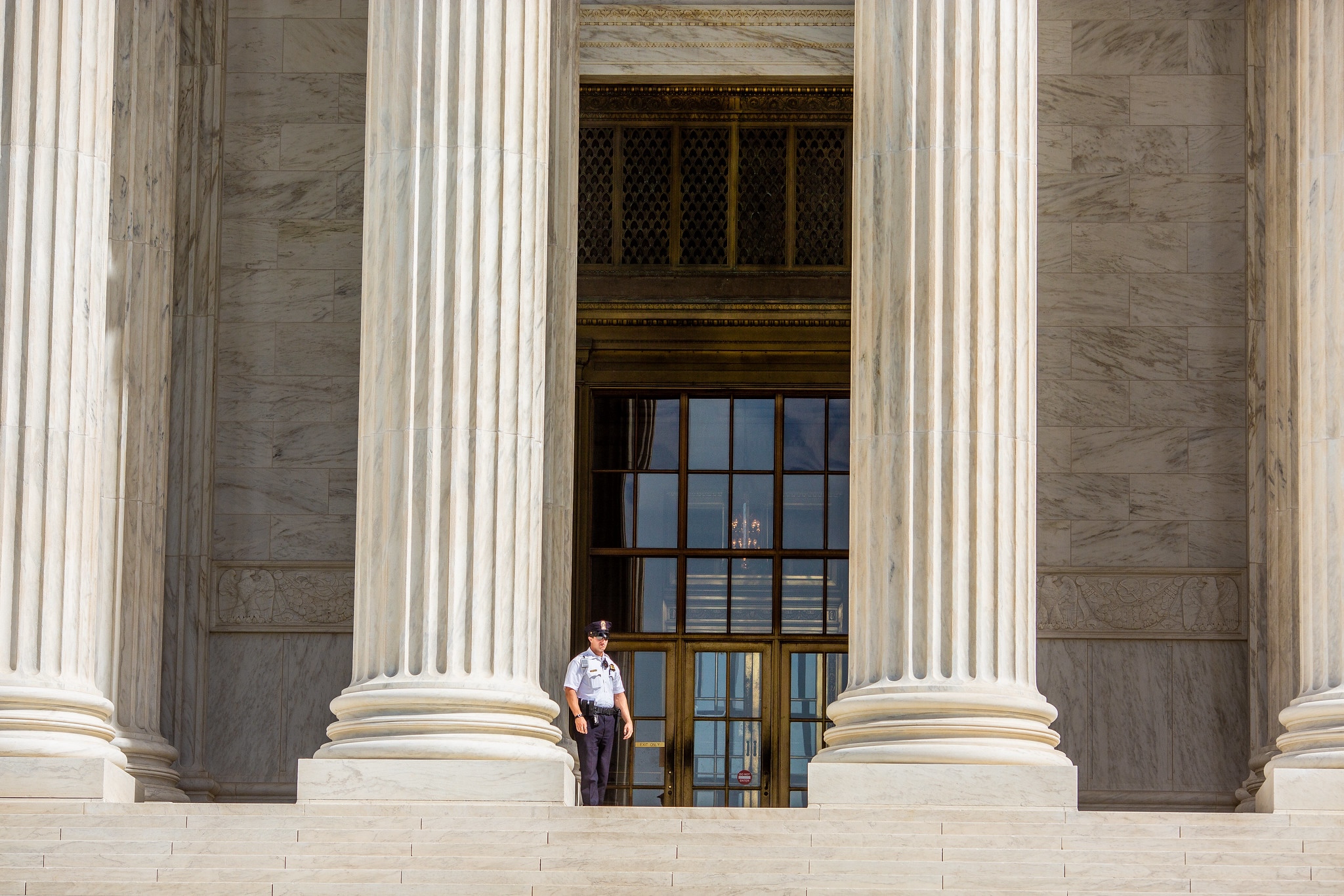 Guard standing on the Supreme Court steps