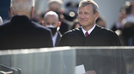 Chief Justice John Roberts squinting in the sun